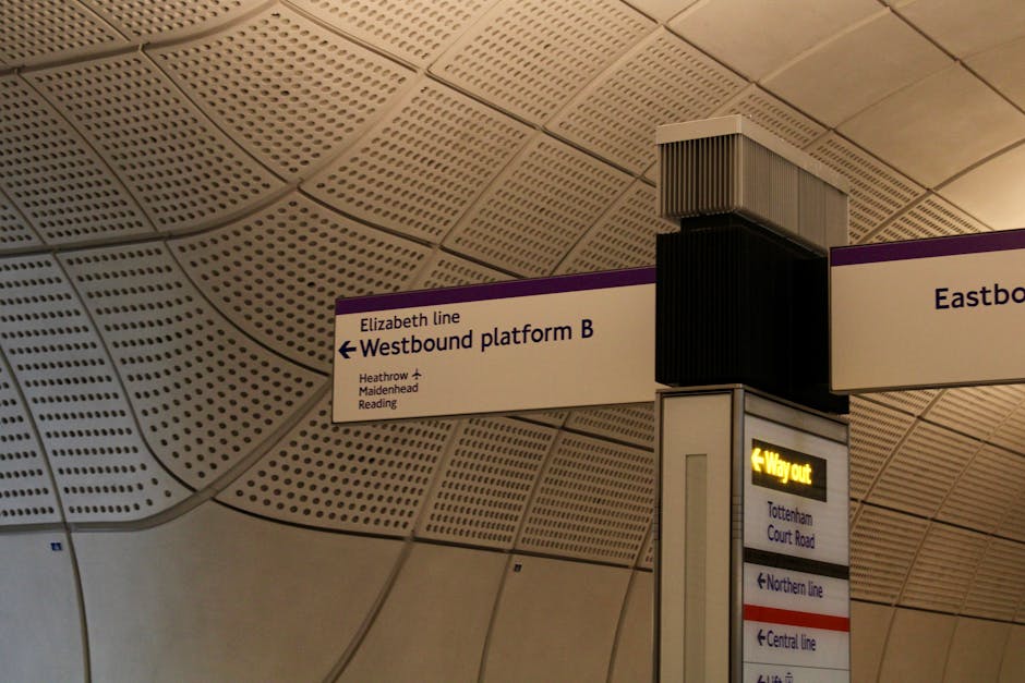 Elizabeth Line signage inside a London Underground station showcasing platform directions.